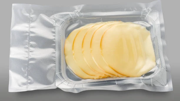 Vacuum-packed sliced provolone cheese in a transparent plastic container